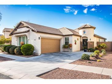 Charming single-story home with a well-manicured front yard and attached two-car garage at 808 E Constance Way, Phoenix, AZ 85042