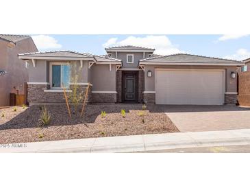 Charming single-Gathering home featuring stone accents, neutral color palette, and a two-car garage at 13803 W Calle De Baca --, Peoria, AZ 85383