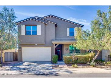 Charming two-story home with a well-manicured yard and inviting curb appeal in a desirable neighborhood at 21407 W Hubbell St, Buckeye, AZ 85396