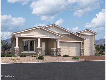 New construction home featuring a two-car garage, a welcoming front porch, and professionally landscaped front yard at 22961 E Twin Acres Dr, Queen Creek, AZ 85142