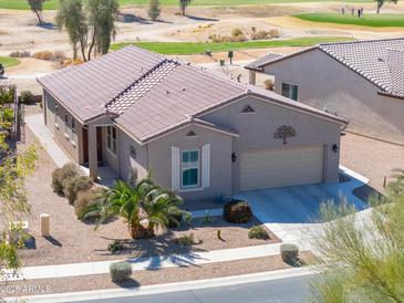 Charming single-story home with desert landscaping, tile roof, and attached two-car garage near the golf course at 2643 E San Ricardo Trl, Casa Grande, AZ 85194