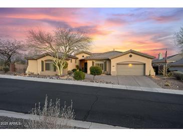 Charming home with a desert landscape and lovely sunset views from the front yard at 41711 N Pinion Hills Ct, Anthem, AZ 85086