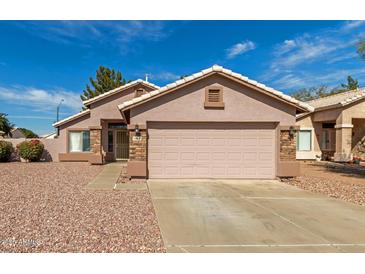 Charming single-story home with a two-car garage and low-maintenance desert landscaping at 7808 W Palo Verde Dr, Glendale, AZ 85303