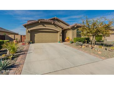 Charming single-story home featuring desert landscaping, a two-car garage, and a welcoming entrance at 12792 E Crystal Forest --, Gold Canyon, AZ 85118