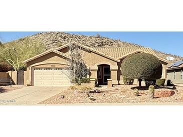 Charming single-story home with desert landscaping and a tile roof at 3602 E Mountain Sky Ave. --, Phoenix, AZ 85044