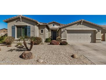 Charming single-story home showcasing a well-maintained desert landscape and a welcoming facade at 4602 E Firestone Dr, Chandler, AZ 85249