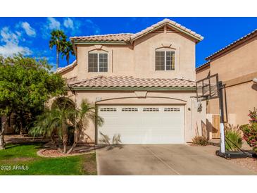 Charming two-story home featuring a two-car garage, tile roof, and desert landscaping at 7520 S Jentilly Ln, Tempe, AZ 85283