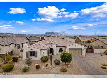 Charming single-story home with a well-manicured front yard and a circular driveway at 1319 N Chatsworth St, Mesa, AZ 85207