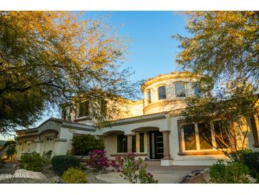 Charming home with desert landscaping, a circular turret, and a welcoming entryway at 22339 N 77Th Way, Scottsdale, AZ 85255
