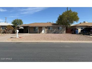 Charming single-story home featuring a low-maintenance gravel yard and neutral color palette at 4621 N 47Th Dr, Phoenix, AZ 85031