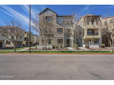 Charming multi-story home showcasing a stone facade and well-manicured landscaping at 2673 S Balsam Dr, Gilbert, AZ 85295