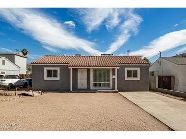 Charming single story home with neutral tones, tile roof and desert landscaping at 4205 N 3Rd Ave, Phoenix, AZ 85013