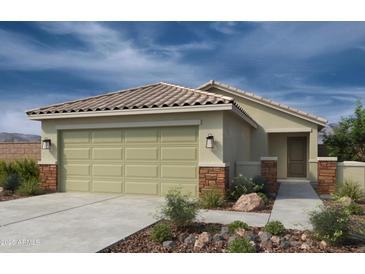 Charming single-story home featuring a tile roof and a two-car garage at 18490 N Tanners Way, Maricopa, AZ 85138