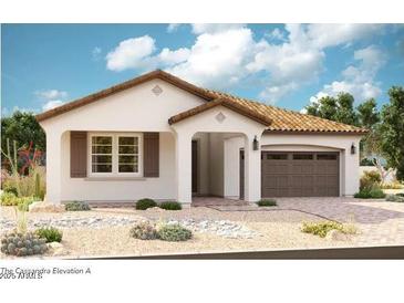 Charming single-story home with a tile roof, two-car garage, and desert landscaping at 21920 E Saddle E Ct, Queen Creek, AZ 85142