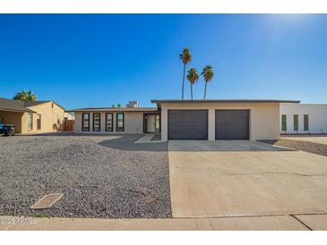 Charming single-story home features a two-car garage, low-maintenance landscaping, and welcoming curb appeal at 12235 N 36Th Dr, Phoenix, AZ 85029