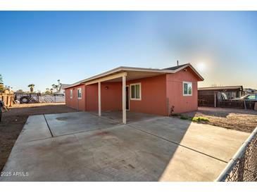 A charming home featuring an open carport and a well-maintained exterior in a residential neighborhood at 1919 E Libby St, Phoenix, AZ 85022