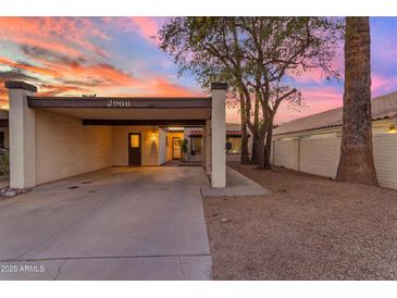 Charming single-story home with covered parking and a well-maintained yard at sunset at 2966 S Country Club Way, Tempe, AZ 85282