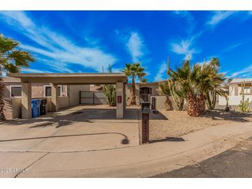 Charming single-story home with covered parking, desert landscaping and mailbox with street number at 4116 N 105Th Ln, Phoenix, AZ 85037
