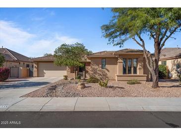 Charming single-story home with desert landscaping, neutral stucco, and a spacious two-car garage at 15442 W Sells Dr, Goodyear, AZ 85395