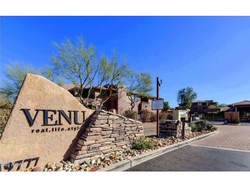 Inviting entrance to the VENU community featuring lush landscaping and a monument sign at 19777 N 76Th St # 2150, Scottsdale, AZ 85255