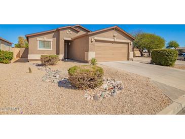 Charming single-story home with desert landscaping and a two-car garage at 1994 E Dust Devil Dr, San Tan Valley, AZ 85143