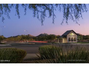 Union Park community entrance with mountain views during twilight hours and landscaping at 25318 N 19Th Dr, Phoenix, AZ 85085