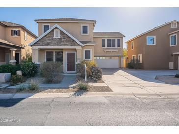 Charming two-story home with stone accents and a well-maintained front yard at 35005 N 30Th Dr, Phoenix, AZ 85086