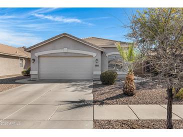 Charming single-story home featuring a well-maintained front yard and a two-car garage at 4091 S Dew Drop Ct, Gilbert, AZ 85297