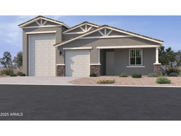 Beautiful single-Gathering home featuring a three-car garage and manicured landscaping at 15769 W Cheryl Dr, Waddell, AZ 85355