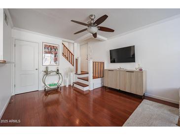 Bright living room with hardwood floors, modern ceiling fan and stylish furnishings at 1701 E Colter St # 10, Phoenix, AZ 85016
