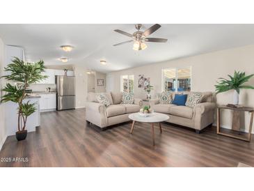 Inviting living room featuring hardwood floors, neutral walls, recessed lighting, and a ceiling fan at 320 E Mckellips Rd # 166, Mesa, AZ 85201
