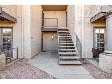Inviting condo exterior with desert landscaping, stairs to the second level, and neutral-toned stucco at 5995 N 78Th St # 1063, Scottsdale, AZ 85250
