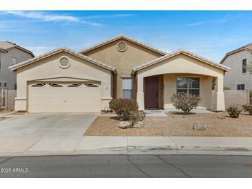 Charming one-story home featuring a two-car garage and low-maintenance landscaping at 1358 E Angie St, Casa Grande, AZ 85122