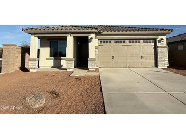 Charming single story home with a two car garage and low maintenance desert landscaping at 17422 W Las Palmaritas Dr, Waddell, AZ 85355