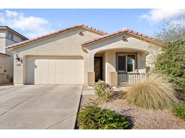 Charming single-story home featuring a stucco facade, well-kept landscaping, and a two-car garage at 20408 E Rosa Rd, Queen Creek, AZ 85142