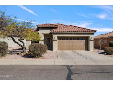 Charming single-story home with a well-maintained front yard, desert landscaping, and a two-car garage at 2910 W Allens Peak Dr, San Tan Valley, AZ 85144
