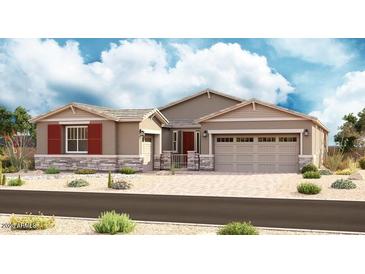 Charming single-story home featuring a two-car garage, stylish stone accents, and desert landscaping at 20624 S 216Th Pl, Queen Creek, AZ 85142