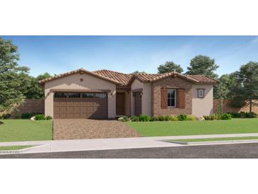 Charming single-story home featuring a brick and stucco exterior, a tile roof, and a well-manicured front yard at 23122 E Lords Way, Queen Creek, AZ 85142