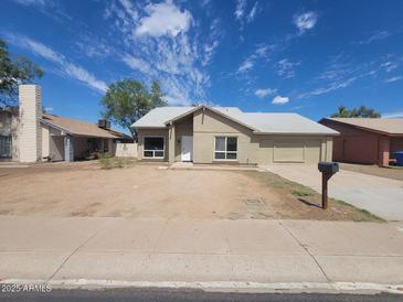 Charming single-story home with desert landscaping and a classic mailbox at 4124 E Apollo Rd, Phoenix, AZ 85042