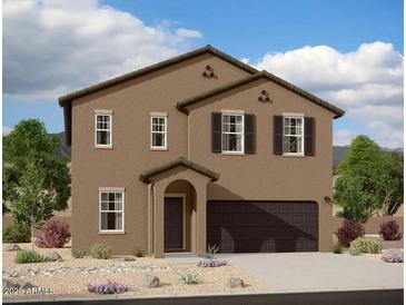 Two-story home showcases a contemporary design with a stucco exterior, and a two-car garage at 9832 W Agora Ln, Tolleson, AZ 85353