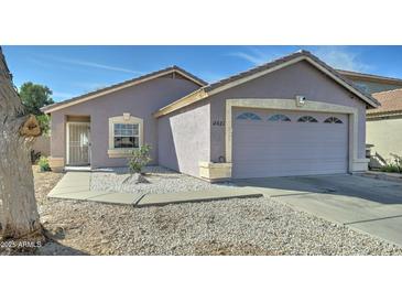 Charming single-story home featuring a two-car garage and low-maintenance desert landscaping at 12621 W Aster Dr, El Mirage, AZ 85335
