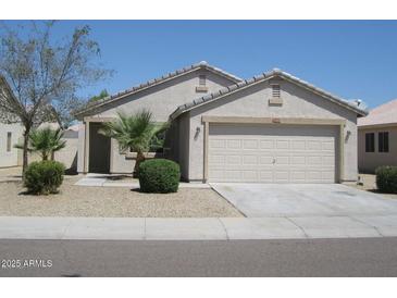 Charming single-story home featuring a two-car garage and low maintenance desert landscaping at 16242 W Sierra St, Goodyear, AZ 85338