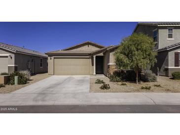 Charming single-story home featuring a two-car garage and well-maintained desert landscaping at 36602 W San Alvarez Ave, Maricopa, AZ 85138