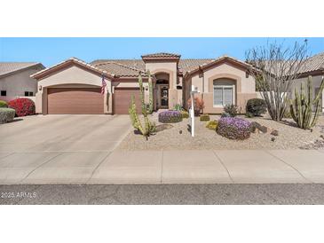 Charming single-story home featuring desert landscaping, a two-car garage, and a covered front entry at 4944 E Dale Ln, Cave Creek, AZ 85331