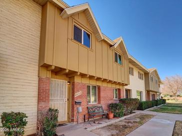 Charming townhome with well-maintained landscaping and a cozy front bench at 8522 E Montebello Ave, Scottsdale, AZ 85250