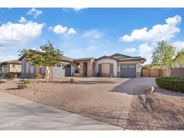 Beautiful single story home with brick paved driveway and two-car garage at 20981 E Watford Dr, Queen Creek, AZ 85142