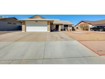 Charming single-story home featuring a two-car garage and well-maintained front yard in a quiet neighborhood at 2202 N Los Altos Dr, Chandler, AZ 85224