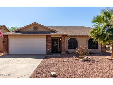 Charming single-Gathering home showcasing a two-car garage, desert landscaping, and a welcoming entrance at 2251 E Remington Pl, Chandler, AZ 85286