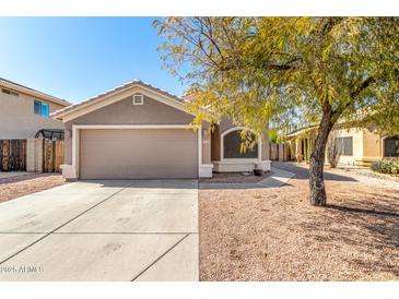 Charming single-story home with a well-maintained front yard and a two-car garage at 23402 N 22Nd Way, Phoenix, AZ 85024