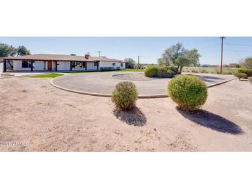 Expansive front yard with circular driveway and mature landscaping at 350 N 9Th St, Coolidge, AZ 85128